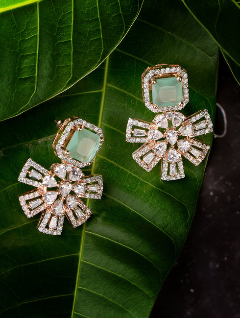 Exquisite Turquoise Floral design pastel blue earrings Rose gold plated AD studded