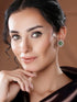 White Rhodium Green Emerald Studded Floral Design Solar Statement Studds Earrings