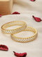 A pair of 2 Gold Dual Toned AD Studded hand Crafted Textuerd Bangles
