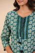 Women Green Floral Printed Tie Up Neck Pure Cotton Kurti