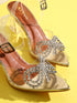 GNIST Gold Pointed Embellished Transparent Bow Heels