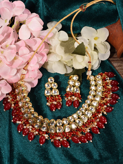Gold Toned Kundan & Red Bead studded Handcrafted Jewellery Set