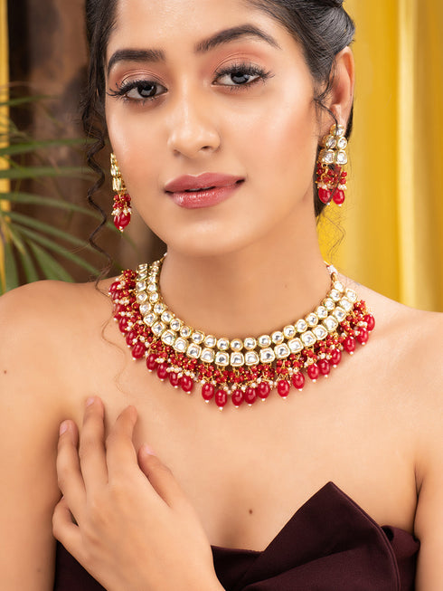 Gold Toned Kundan & Red Bead studded Handcrafted Jewellery Set