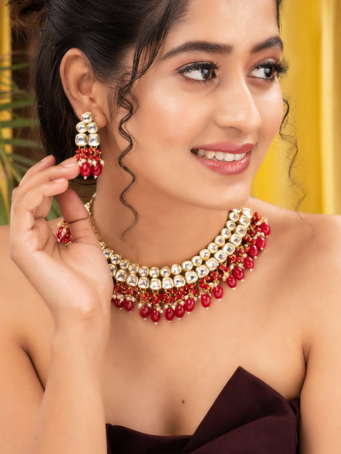 Gold Toned Kundan & Red Bead studded Handcrafted Jewellery Set