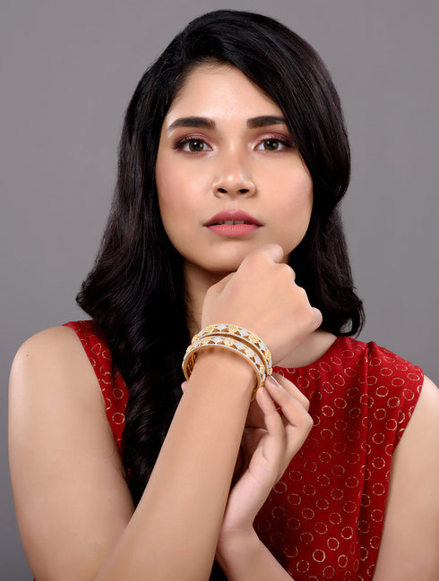 A Pair of 2 Gold Toned Intricate design Bangle Bracelet