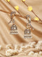 Antique Gold-Toned Parrot Motif Pearl Beaded Handcrafted Jhumka Earrings