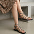 Women's Patent Studded Gladiator Flat Sandals